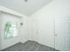 Bedroom with neutral walls, gray floors, and closet at 207 Apache Dr, Summerville, SC 29483
