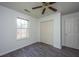Bedroom with grey floors, and double door closet at 207 Apache Dr, Summerville, SC 29483