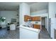 Bright kitchen area with wood cabinets, sleek countertop, and open view into the adjacent living area at 207 Apache Dr, Summerville, SC 29483