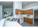Bright kitchen area with wood cabinets, sleek countertop, and open view into the adjacent living area at 207 Apache Dr, Summerville, SC 29483