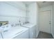 Bright laundry room with white washer and dryer at 207 Apache Dr, Summerville, SC 29483