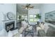 Bright living room with vaulted ceiling, fireplace, comfortable seating, and view into dining area at 207 Apache Dr, Summerville, SC 29483
