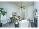 Open living room with vaulted ceiling, fireplace, ceiling fan, and view into dining area at 207 Apache Dr, Summerville, SC 29483