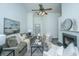 Cozy living room featuring a fireplace, ceiling fan, comfortable seating, and a view to the front door at 207 Apache Dr, Summerville, SC 29483