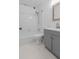 Bathroom with a tub, shower, toilet, grey vanity, and framed mirror at 207 Terry Ave, Summerville, SC 29485