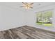 Bright bedroom features a modern ceiling fan, a large window, carpet, and neutral colors at 207 Terry Ave, Summerville, SC 29485