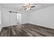 Bedroom featuring a sliding barn door leading to the bath, ceiling fan, and vinyl plank flooring at 207 Terry Ave, Summerville, SC 29485