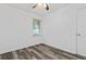 Bright bedroom with a ceiling fan, plank flooring, and a door to the side at 207 Terry Ave, Summerville, SC 29485