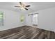Bedroom featuring a sliding barn door leading to the bath, ceiling fan, and vinyl plank flooring at 207 Terry Ave, Summerville, SC 29485