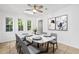 Bright dining room featuring a marble table, modern decor, and three windows for ample natural light at 207 Terry Ave, Summerville, SC 29485