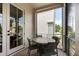 Screened balcony with a round table and chairs, offering a pleasant outdoor dining space at 211 Line St, Charleston, SC 29403