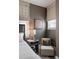 Well-lit bedroom showcasing modern decor, textured walls, and comfortable seating at 211 Line St, Charleston, SC 29403