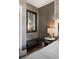 Stylish bedroom nook with unique mirror, textured wall, and modern accents at 211 Line St, Charleston, SC 29403