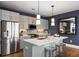 Modern kitchen with stainless steel appliances, a center island, and stylish backsplash at 211 Line St, Charleston, SC 29403
