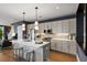 Modern kitchen with stainless steel appliances, an island with seating, and gray cabinets at 211 Line St, Charleston, SC 29403