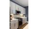 Modern kitchen with stainless steel appliances, stylish backsplash, and gray cabinets at 211 Line St, Charleston, SC 29403