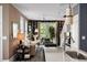 Living room featuring stylish decor, a ceiling fan, and access to the outdoor area at 211 Line St, Charleston, SC 29403