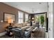 Comfortable living room with neutral tones, plantation shutters, and access to the outdoor area at 211 Line St, Charleston, SC 29403