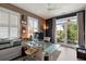 Bright home office with glass desk, modern decor, and private balcony access at 211 Line St, Charleston, SC 29403