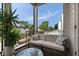 Cozy patio featuring stylish seating, potted plant, and neighborhood views at 211 Line St, Charleston, SC 29403