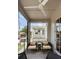 Screened porch offering comfortable seating with cushioned chairs and privacy from the street at 211 Line St, Charleston, SC 29403