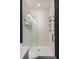 Elegant bathroom with a walk-in shower, white subway tile, and modern fixtures at 211 Line St, Charleston, SC 29403