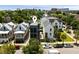 A beautiful property located at 211 Line St., surrounded by charming homes and a bustling street scene filled with cars at 211 Line St, Charleston, SC 29403