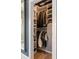 Walk-in closet with custom shelving, hanging racks, and ample storage space for clothes and shoes at 211 Line St, Charleston, SC 29403