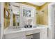 Bathroom with tiled floors, dual sinks with vanity, and white cabinets at 22 Lamboll St # C, Charleston, SC 29401