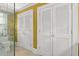 Bathroom with tiled floor, glass shower, and large closet with paneled doors at 22 Lamboll St # C, Charleston, SC 29401