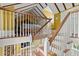 Staircase view of upper-level bedroom with exposed beams, hardwood floors, and cozy decor at 22 Lamboll St # C, Charleston, SC 29401