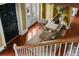 Foyer features hardwood floors, area rug, animal print seating, and view to the front door at 22 Lamboll St # C, Charleston, SC 29401
