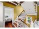 Hallway features decorative wallpaper, a window, and a staircase view to a bedroom at 22 Lamboll St # C, Charleston, SC 29401