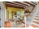 Charming living room featuring exposed wood beams, a brick fireplace, and stylish decor at 22 Lamboll St # C, Charleston, SC 29401
