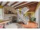 Living room features an ornate brick fireplace and staircase at 22 Lamboll St # C, Charleston, SC 29401