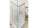 Bright shower features a glass door and floor-to-ceiling marbled tile at 22 Lamboll St # C, Charleston, SC 29401