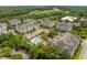 Aerial view showcasing the community's pool and well-maintained apartment buildings amidst lush greenery at 2244 Ashley Crossing Dr # 1125, Charleston, SC 29414