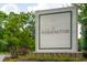 The Arboretum community sign with manicured landscaping and vibrant flowers at 2244 Ashley Crossing Dr # 1125, Charleston, SC 29414