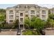 An inviting exterior elevation showing balconies and well-kept landscaping, with ample parking at 2244 Ashley Crossing Dr # 1125, Charleston, SC 29414