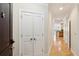 Entryway with closet and seamless view of the kitchen featuring sleek hardwood floors at 2244 Ashley Crossing Dr # 1125, Charleston, SC 29414