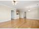 Spacious living room featuring hardwood floors and neutral wall color at 2244 Ashley Crossing Dr # 1125, Charleston, SC 29414
