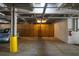 Secure garage parking with storage, marked spaces, and a fire extinguisher for safety at 2244 Ashley Crossing Dr # 1125, Charleston, SC 29414