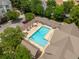 Overhead shot of a community pool with lounge chairs and pergola sunshade on a bright day at 2244 Ashley Crossing Dr # 1125, Charleston, SC 29414