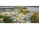 Stunning aerial view of a coastal community featuring beautifully landscaped homes, waterways, and marshland views at 2313 Bucktail Ct, Mount Pleasant, SC 29466