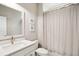 Bright bathroom features a modern vanity, decorative artwork, and a shower with a curtain at 2313 Bucktail Ct, Mount Pleasant, SC 29466