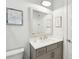 Neutral bathroom with white vanity top, grey cabinets, and framed map artwork at 2313 Bucktail Ct, Mount Pleasant, SC 29466