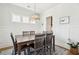 Bright dining room with wainscoting, chandelier, and large table for six at 2313 Bucktail Ct, Mount Pleasant, SC 29466