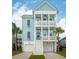 Charming two-story coastal home with light blue siding, white trim, and double front porches at 2313 Bucktail Ct, Mount Pleasant, SC 29466