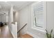 Hallway featuring a window and natural light highlighting the stairwell at 2313 Bucktail Ct, Mount Pleasant, SC 29466