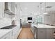 Bright open concept kitchen with stainless appliances and view to the living area at 2313 Bucktail Ct, Mount Pleasant, SC 29466